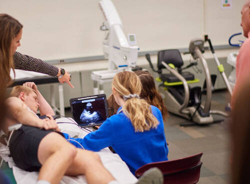 Students observe scan together